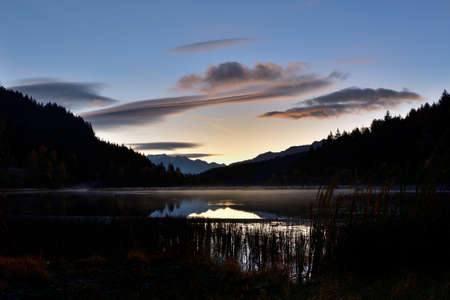 Pian di Gembro is a natural park in the center of the Alps. The colors in autumn at the sunrise make this place magnificent.の写真素材