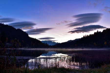 Pian di Gembro is a natural park in the center of the Alps. The colors in autumn at the sunrise make this place magnificent.の写真素材