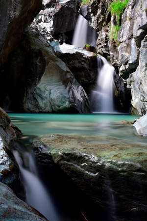 The green water between the waterfalls of Lanterna creekの写真素材
