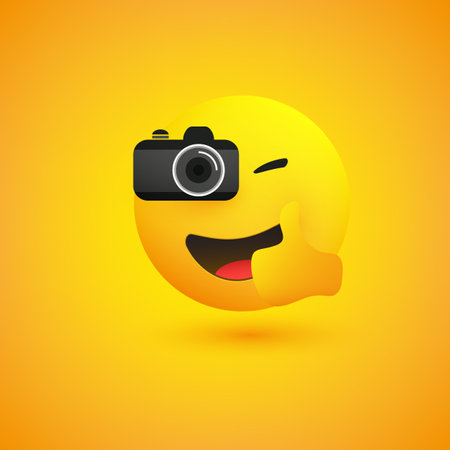 Simple Shiny Happy Smiling Photographer Emoji Taking Picture with a Digital Camera and Showing Thumbs Up - Emoticon on Yellow Backgroundのイラスト素材