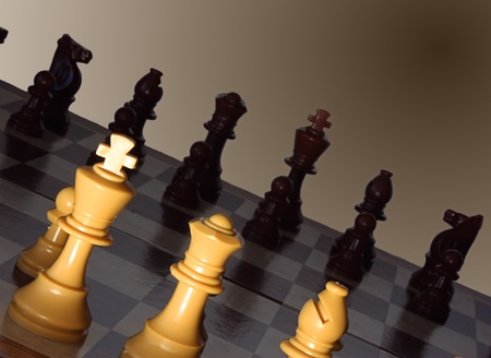 Chess board with king and queen highlighted on gradient brown background.