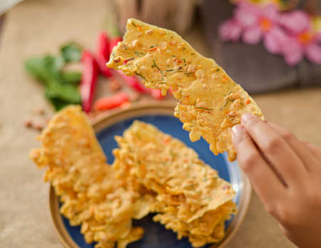 Peyek kacang or shrimp crackers are one of the traditional authentic food from Indonesia made from flour dough with peanut and baby shrimp.の写真素材