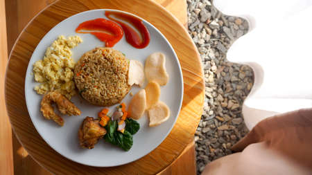 Fried rice or Nasi Goreng with scrambled egg, chicken and shrimpの写真素材