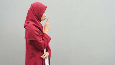 Asian muslim woman shut up signの写真素材