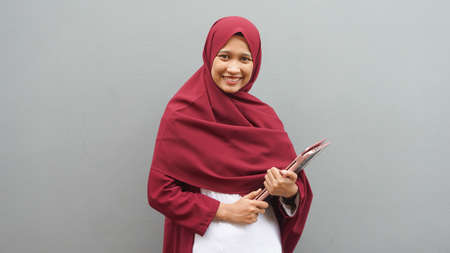 Asian muslim woman with notebook. Teacher professionの写真素材