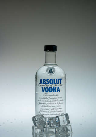 12 Augsut 2020, Yogyakarta, Indonesia: Vodka bottle water splash with iced cube propertiesのeditorial素材
