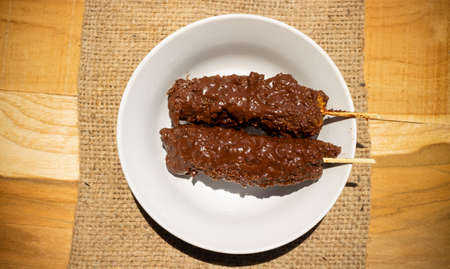 Banana coasted by chocolate which is very sweetの写真素材