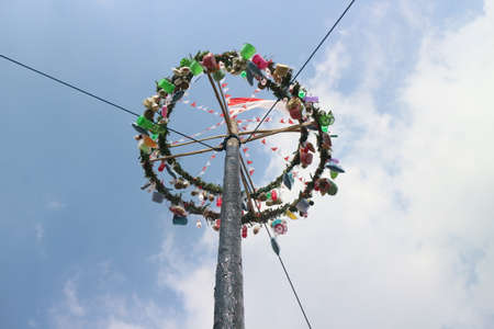 Traditional game from Indonesia named Panjat Pinang. This game won prizes that were mounted on top of the areca tree by climbing.のeditorial素材