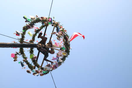 Traditional game from Indonesia named Panjat Pinang. This game won prizes that were mounted on top...