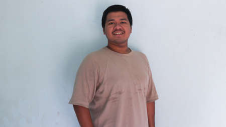 asian fat man smilling poseの写真素材