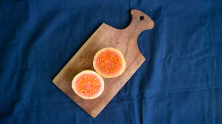 Red Guava on top Wooden base of a trayの写真素材