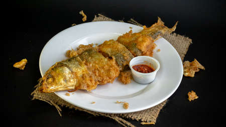 Bandeng Presto Goreng. Fried tendered-bone milkfish served with traditional side dishesの写真素材