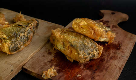 Bandeng Presto Goreng. Fried tendered-bone milkfish served with traditional side dishesの写真素材
