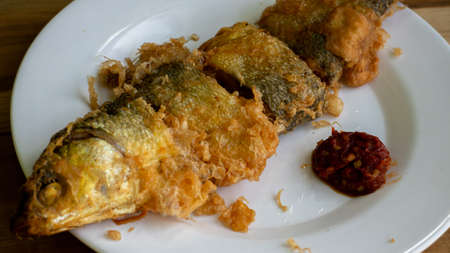 Bandeng Presto Goreng. Fried tendered-bone milkfish served with traditional side dishesの写真素材