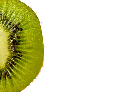 Macro shot of fresh kiwi fruit isolated on white with copy spaceの写真素材