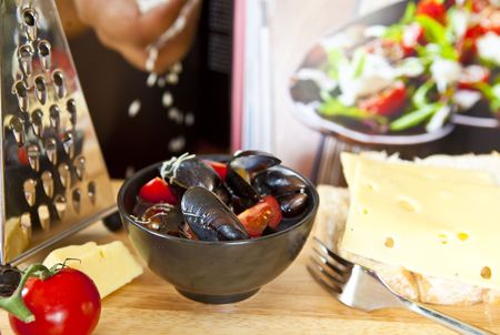 Mussels saute  with fresh cheese and breadの写真素材