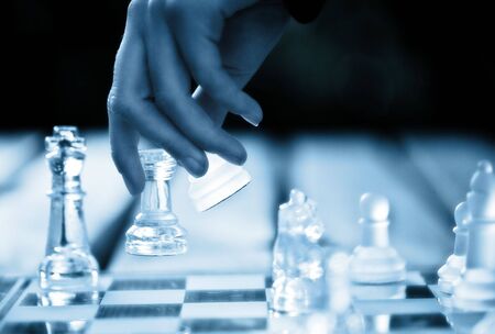 hand making a winning chess moveの写真素材