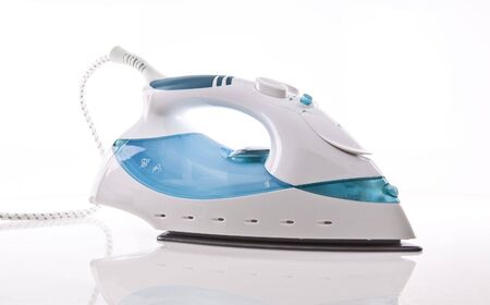 Electric Steam iron on white backgroundの写真素材