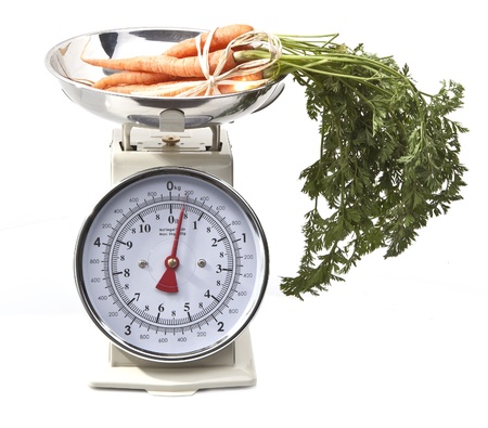 Old style kitchen scales with carrots on white background Isolatedの写真素材