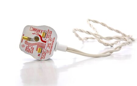 13 Amp UK electrical three pin plug on white background with diagramの写真素材