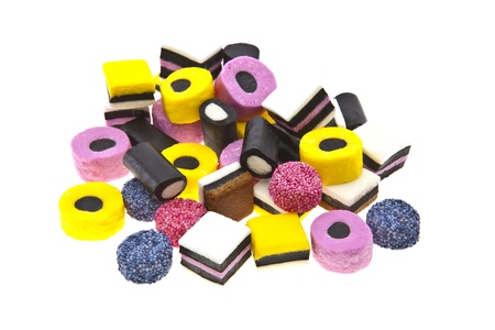 Liquorice allsort sweets in colourful abstract stack design isolated over white background.のeditorial素材