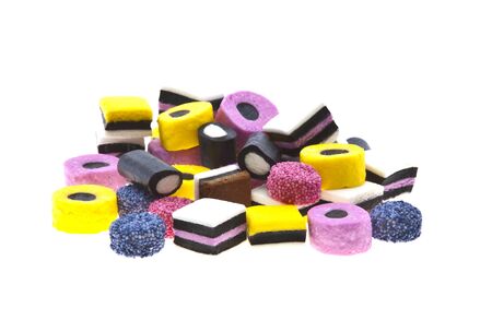 Selection of liquorice sweets in colourful abstract stack design isolated over white background.のeditorial素材