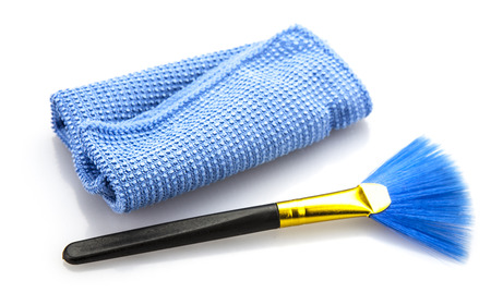 Comper Dust cleaingr brush and cloth on white backgroundの写真素材
