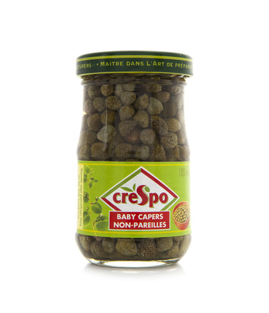 SWINDON, UK - FEBRUARY 16, 2014: Jar of Crespo Baby Capers on a white backgroundのeditorial素材