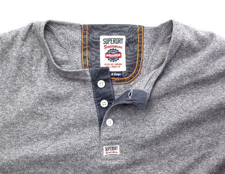 SWINDON, UK - DECEMBER 27, 2014: Superdry Sportswear showing logo on a White Backgroundのeditorial素材