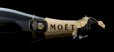 SWINDON, UK - JANUARY 7, 2017: Open Bottle of Moet and Chandon Brut Imperial champagne on a black backgroundのeditorial素材