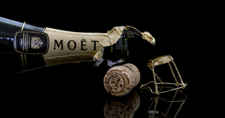 SWINDON, UK - JANUARY 7, 2017: Open Bottle of Moet and Chandon Brut Imperial champagne on a black backgroundのeditorial素材