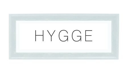 HYGGE  on a white background, Hygge is a Danish and Norwegian word which can be described as a quality of cosiness and comfortable conviviality that engenders a feeling of contentment or well-being.の写真素材