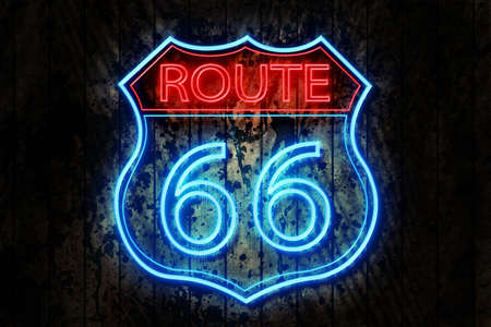 Route 66 Neon Sign on a Dark Wooden Wall