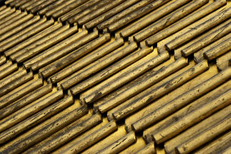 detail of roofing tiles painted goldの写真素材