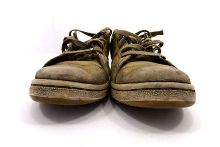 closeup of a pair of worn sneakersの写真素材