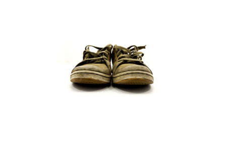 closeup of a pair of worn sneakersの写真素材