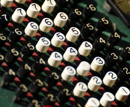 a close-up of the keys of an old calculator