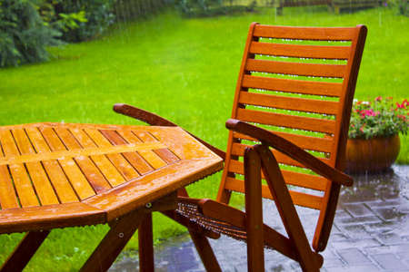 garden table stands in the rainの写真素材