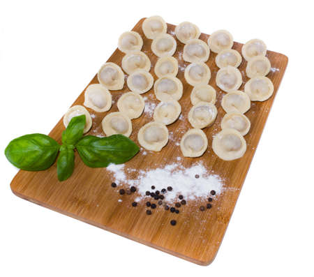 Russian pelmeni with basil and black pepperの写真素材