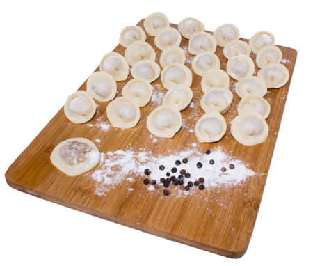 Russian pelmeni with basil and black pepperの写真素材