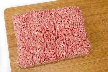 minced meat on a cutting boardの写真素材