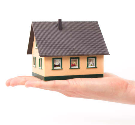 Realty concept - hand holding houseの写真素材