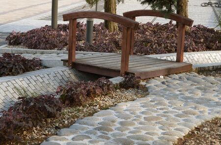a bridge on a path in the parkの写真素材