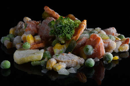 set of frozen vegetables on a black backgroundの写真素材