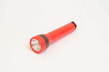 A red colored torchlight on white backgroundの写真素材
