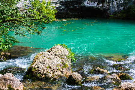 Mountain pond with beautiful green-blue water.の写真素材