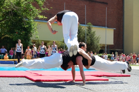 Three young men show their acrobatic stunts in Gymnastics event in Novi Sad in Serbia, 16. 06. 2012.のeditorial素材