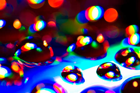 Colorful water drops are on abstract background.の写真素材