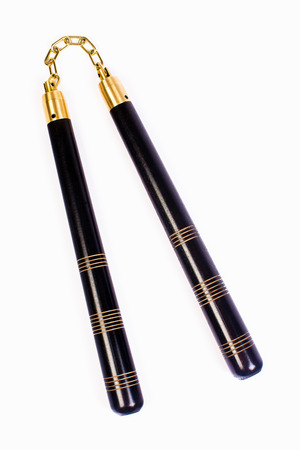 Nunchaku, the traditional asian weapon is isolated on white background.の写真素材