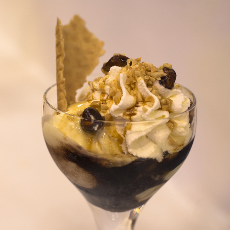 Chocolate dessert with ice cream and whipped cream in cup.の写真素材